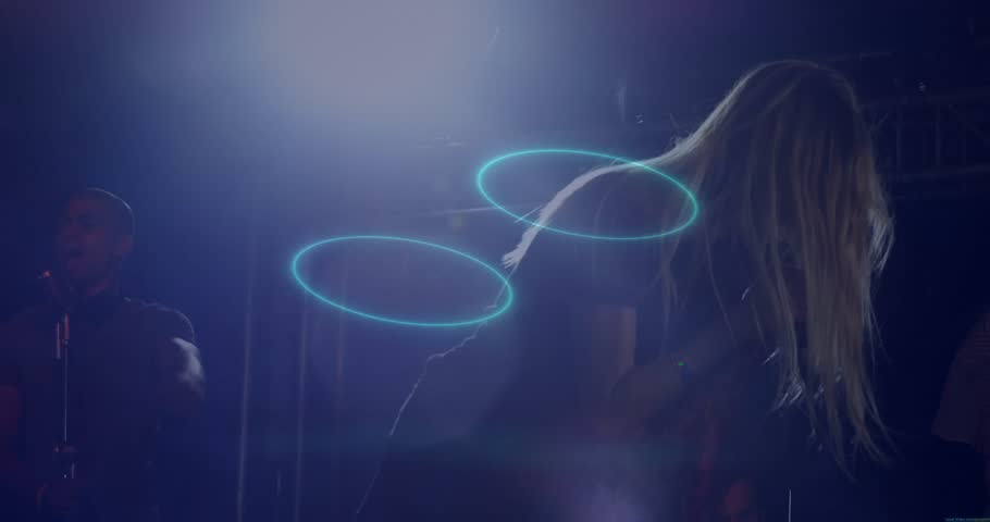 Singer and performer leaning into microphone, mixing live music scene with neon ring overlays. Concert, performance, nightlife, stage, vocal, ambiance, trendy