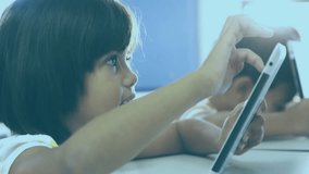sibling duo tapping and dragging tablet stylus in education, showing animated timeline data visuals. Children, technology, innovation, education, interaction, digital, family - Powered by Shutterstock - Get 15% off with code: PIKWIZARD15