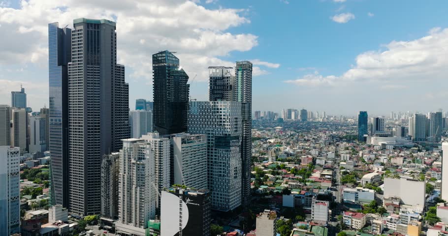 Makati City with tower residences and commercial buildings. Metro Manila, Philippines.