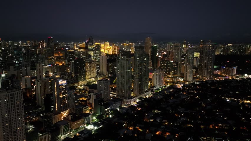 City at Night with modern residential buildings. Makati Skyline. Metro Manila. Philippines.