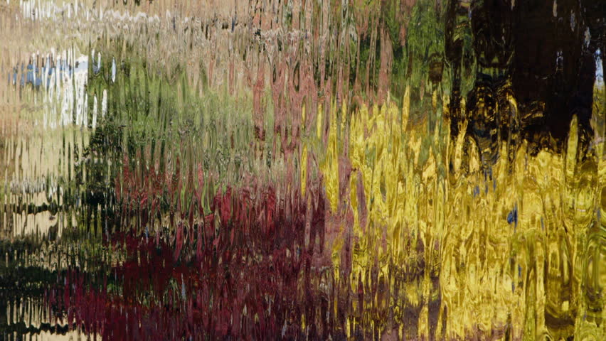 Vertical format: Colorful autumn reflection in pond water, abstract