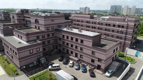 Aerial Diagonal Flight above Hospital Rooftop