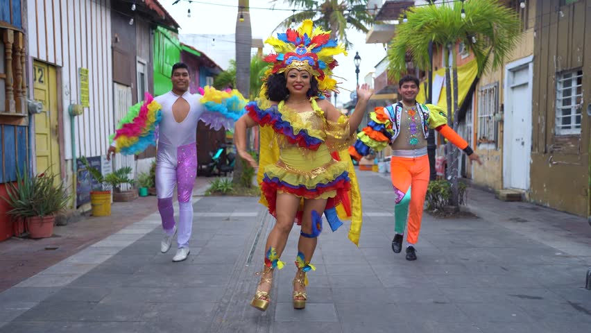Costumed performers celebrating Latin American culture on a vibrant city street