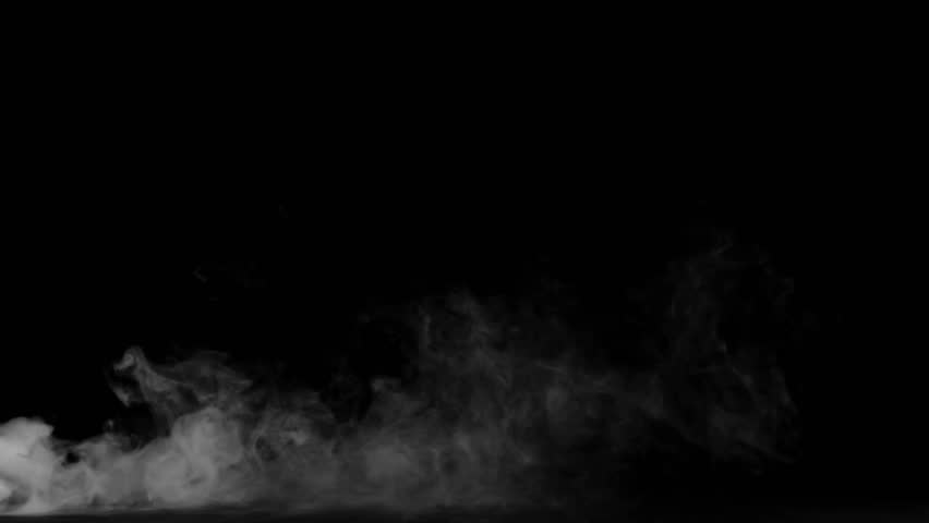 Wispy ethereal white smoke gently flows along the bottom edge against a stark black background providing a dramatic visual element for special effects or cinematic layering purposes.