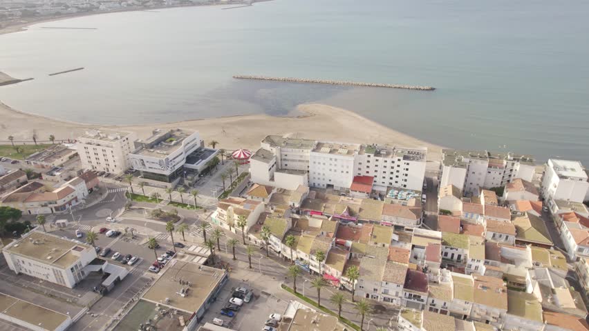 Aerial View Of Plage Rive Gauche, Carroussel Le Tourbillon And Coastal Town In Le Grau-du-Roi, France.