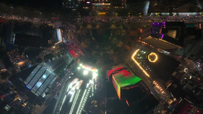 Ho Chi Minh City at Night, the skyline along Saigon River, Vietnam. Aerial Shot of Illuminated skyscrapers, city lights, and urban traffic of modern Asian metropolis.