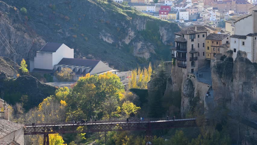 Cuenca, Spain: The iconic Hanging Houses (Casas Colgadas) built on the cliff edge. A UNESCO site overlooking the Huécar gorge and the iron San Pablo bridge.