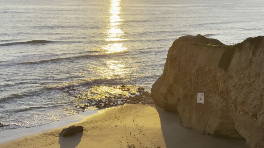 View of the sea and rocks of the beach of Olhos de Agua, Albufeira, Algarve, Portugal.