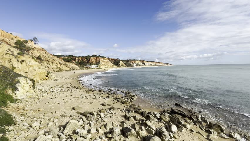 View of the sea and rocks of the beach of Olhos de Agua, Albufeira, Algarve, Portugal.