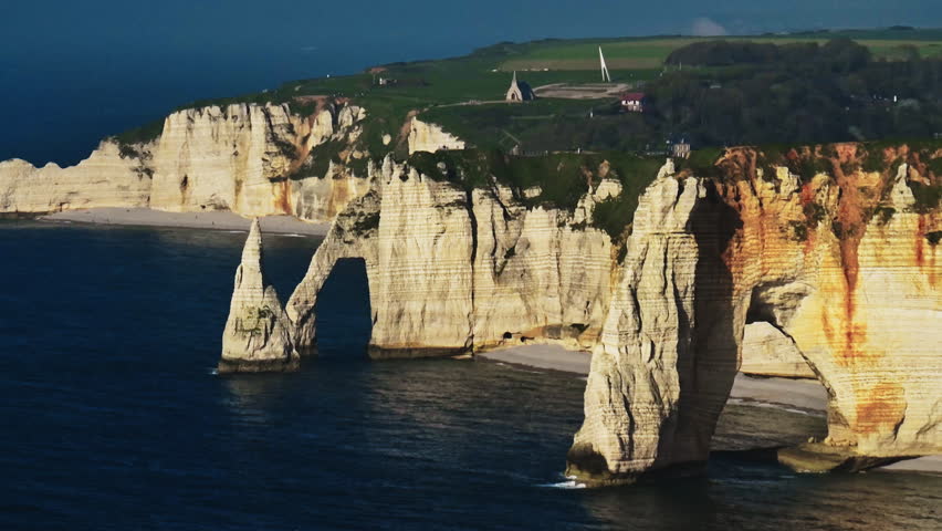 Aerial view of picturesque coastal limestone cliffs. Etretat, France