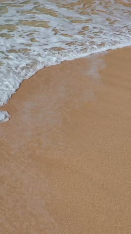 Aerial drone video. Beautiful tropical beach with sand and turquoise water. Top view of an empty and clean beach. Mediterranean Sea, Türkiye.