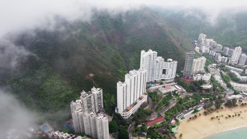 Cloudy aerial view of the beach and buildings in Hong Kong.
