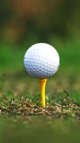 Vertical Shot Of Golf Club Hitting Ball In Slow Motion. Professional Sport Action And Precision Concept	