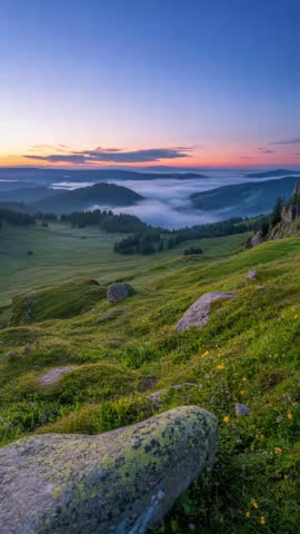 Scenic natural landscape featuring mountains, green valley, and peaceful outdoor environment.