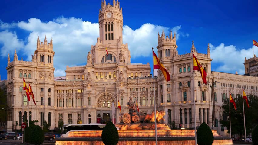 Cybele Palace and Plaza de Cibeles in Madrid at Sunset 

Madrid, Spain, Cybele Palace, Palacio de Cibeles, City Hall, Plaza de Cibeles, fountain, sunset, architecture, neoclassical, white building, communications palace, landmark, tourism, travel, Europe, Spanish, city, urban, traffic, square, capital, historic, monument, heritage, majestic, evening, skyline, exterior, blue sky, golden hour, vacation, sightseeing, destination, culture, artistic, iconic, building, town hall, cultural, photography, travel destination, western europe, tourist attraction, scenic, beautiful, historical, plaza, city center, grand.