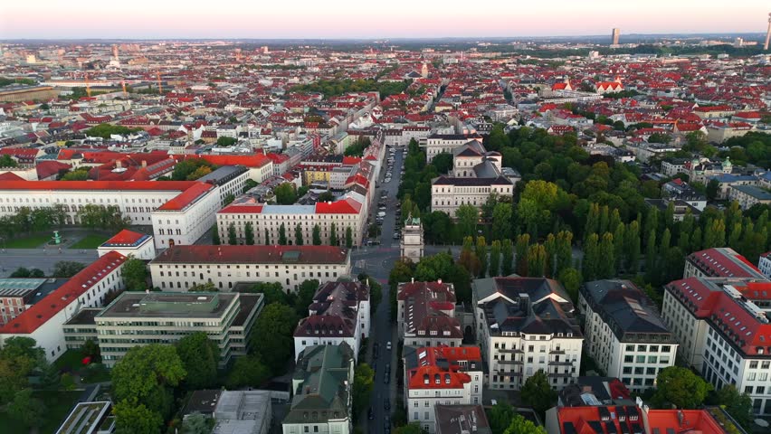 Sunrise aerial of Munich city center with Siegestor, Bavarian monument with four lions, Ludwigstrasse, Munich, Germany, summer cityscape, perfect for architecture, tourism, and European heritage