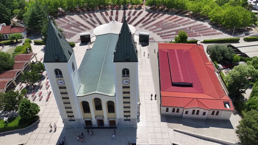 Drone close up of St James Church in Medjugorje focusing on architectural details and spiritual symbolism