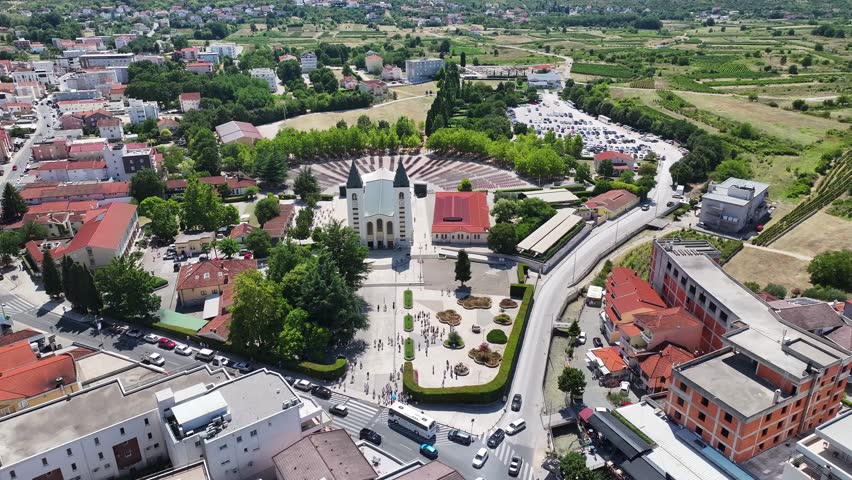 Aerial view of landscape around St James Church in Medjugorje showing village hills and pilgrimage area