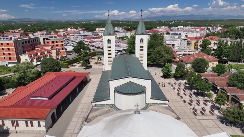 Close aerial view of St James Church in Medjugorje focusing on sacred architecture