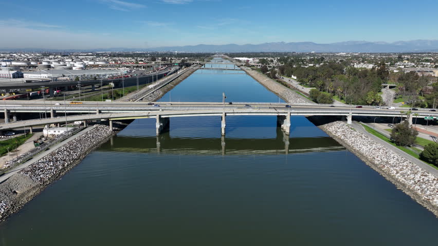 Los Angeles River in Downtown Long Beach, California, USA - High Aerial View of the Water Coming From the Mountains With the Ocean Blvd Overpass Exit  Next to the 710 Freeway
