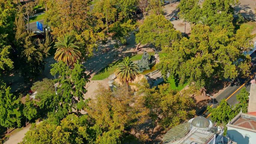 Aerial View of city streets and German Fountain Monument at Parque Forestal in Santiago, Chile