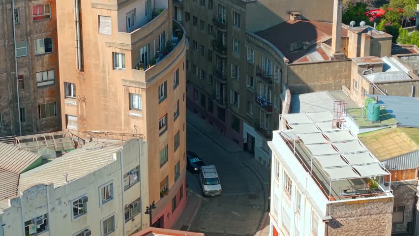 Aerial fly narrow street Historic colorful Neighborhood in Santiago, Chile Downtown