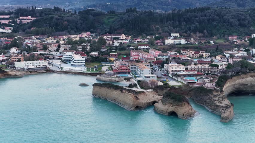 Aerial Drone View of Famous Canal D'Amour and Sidari Village in Corfu Greece with Unique Sandstone Rock Formations and Turquoise Ionian Sea During Overcast Day