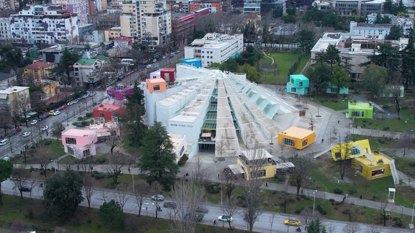 Pyramid of Tirana featuring colorful cube buildings and urban traffic roads
