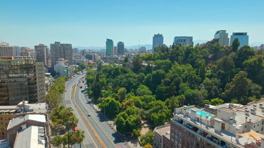 Panoramic Aerial fly Urban green park and Alameda Avenue Downtown Santiago, Chile Daytime