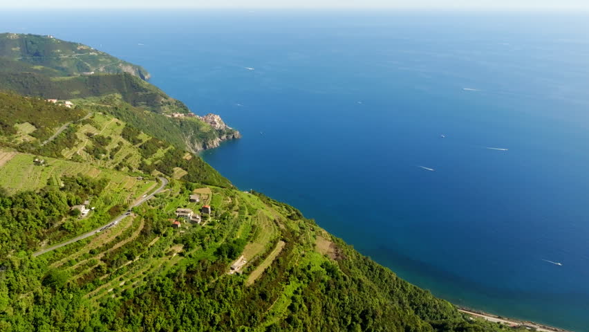 Panoramic drone shot of the mountainous coastline of Cinque terre, Italy, summer