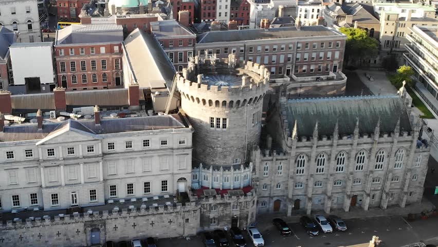 Drone crane over Dublin Castle tower to square. Ireland government building, historical.