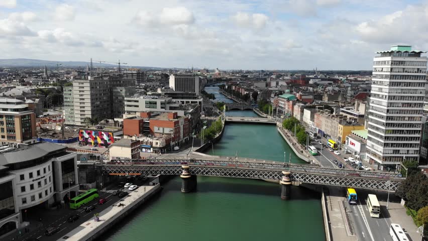 Georges Quay and Loopline Train Bridge on River Liffey in Dublin City Centre, Ireland. Drone