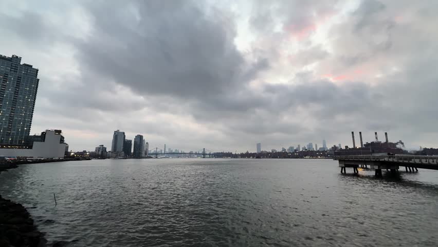 A cloudy skyline view of Manhattan from the waterfront, evoking calmness