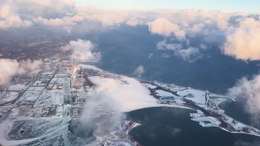 Aerial view of snowy Ontario, plane in skyline, serene winter landscape