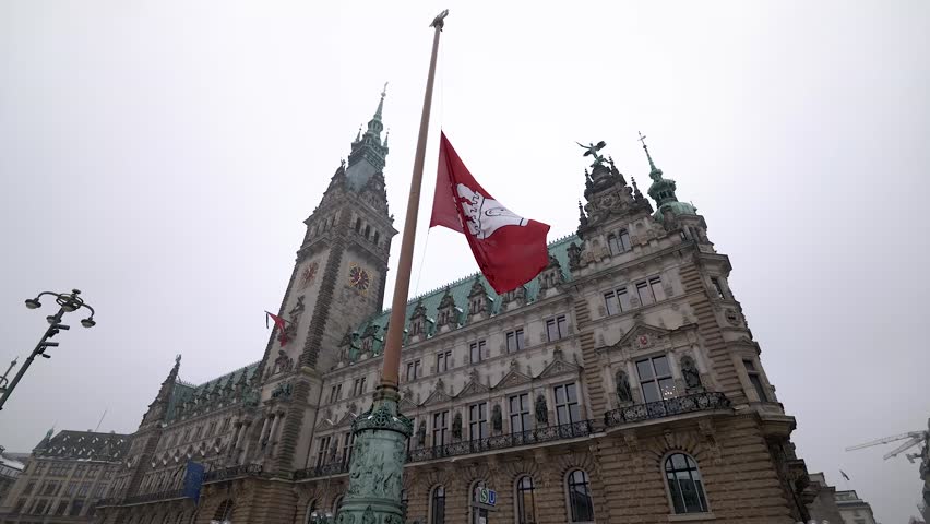 The Rathaus, the city hall of Hamburg, Germany, features architectural details reflecting the winter season and snow.