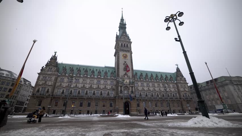The Rathaus, the city hall of Hamburg, Germany, features architectural details reflecting the winter season and snow.