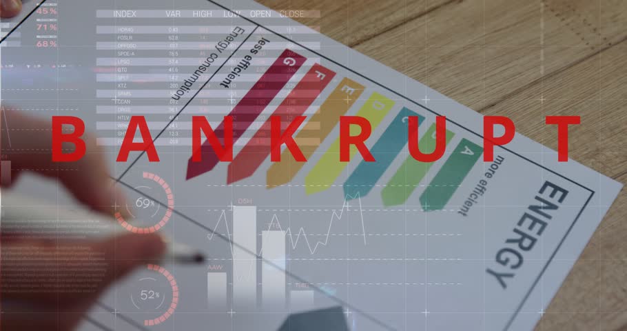 Hand entering frame, placing pen over house box letter A, marking energy amid BANKRUPT HUD. Efficiency, assessment, charts, graphs, overlay, overhead, workspace