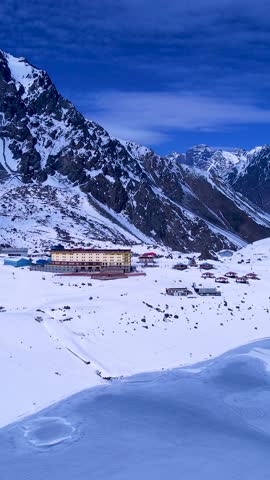 Santiago Chile. Ski station center at snowing Andes Mountains near Santiago Chile. Snow mountain landscape at winterness. Winter ness travel destination. Winter ness tourism travel.