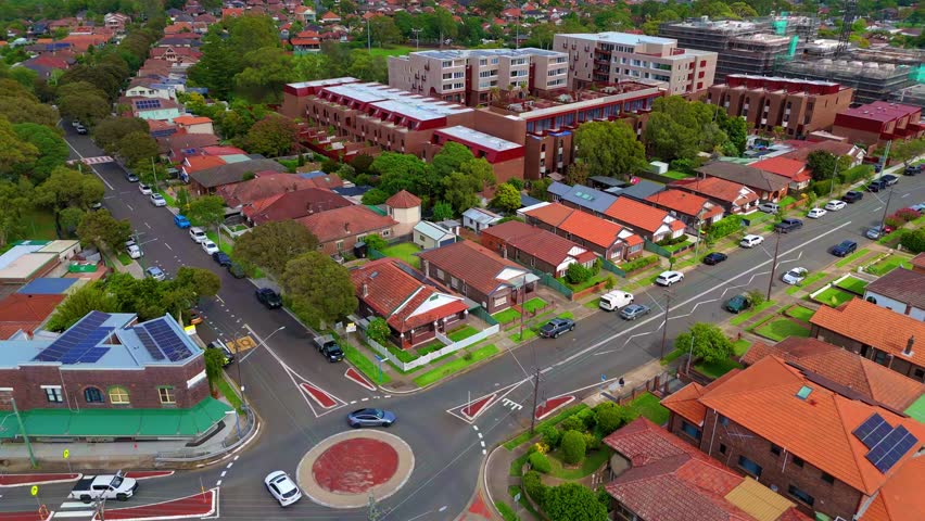 Drone panoramic aerial view of Sydney NSW Australia city Skyline and looking down on roof tops streets roads trees and parks in Suburban Sydney inner west suburbs of Burwood Ashfield Croydon Summer Hill Canterbury Marrickville 
