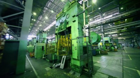TOGLIATTI - SEP 30: Rows of huge machines at workshop of factory VAZ, (shown in motion) on September 30, 2011, Togliatti, Russia. AvtoVAZ factory was founded in 1966