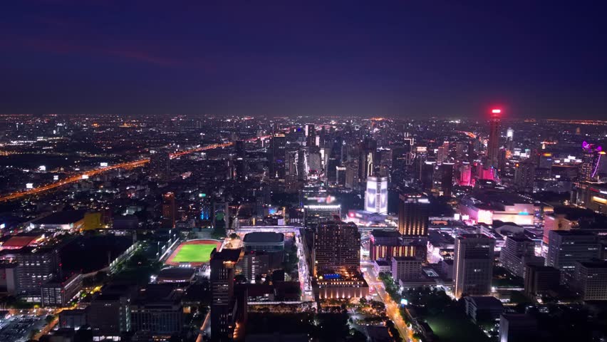 Night cityscape with modern skyscrapers and road traffic Bangkok Thailand, Aerial view.