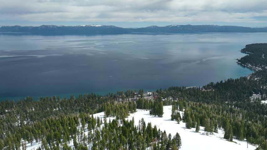 Aerial view over the snowy Homewood Mountain Resort on Ellis Peak at Lake Tahoe