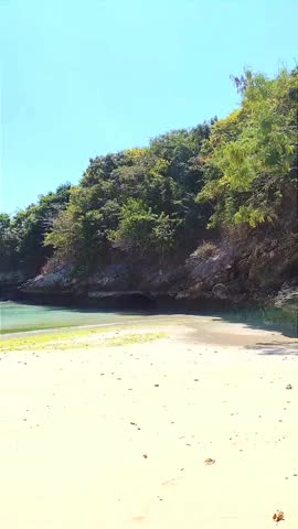 Tropical Beach with Traditional Boats and Clear Blue Sea