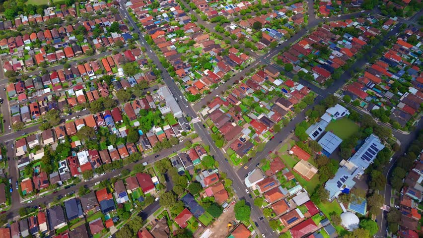 Drone panoramic aerial view of Sydney NSW Australia city Skyline and looking down on roof tops streets roads trees and parks in Suburban Sydney inner west suburbs of Burwood Ashfield Croydon Summer Hill Canterbury Marrickville 