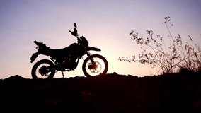 Motorcycle silhouette against a beautiful sunset sky - Powered by Shutterstock - Get 15% off with code: PIKWIZARD15