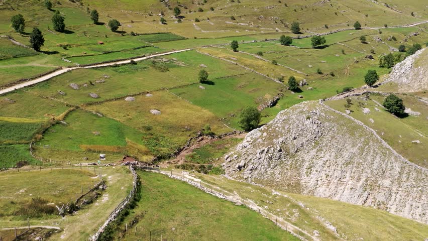 Aerial view of mountain pasture landscape