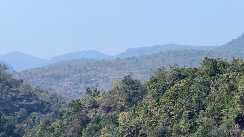 Scenic landscape view show mountains covered with lush trees. Nature, peace, and travel use