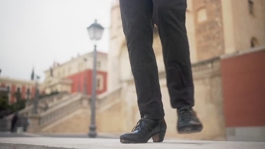 Flamenco dancer feet tapping on spanish street