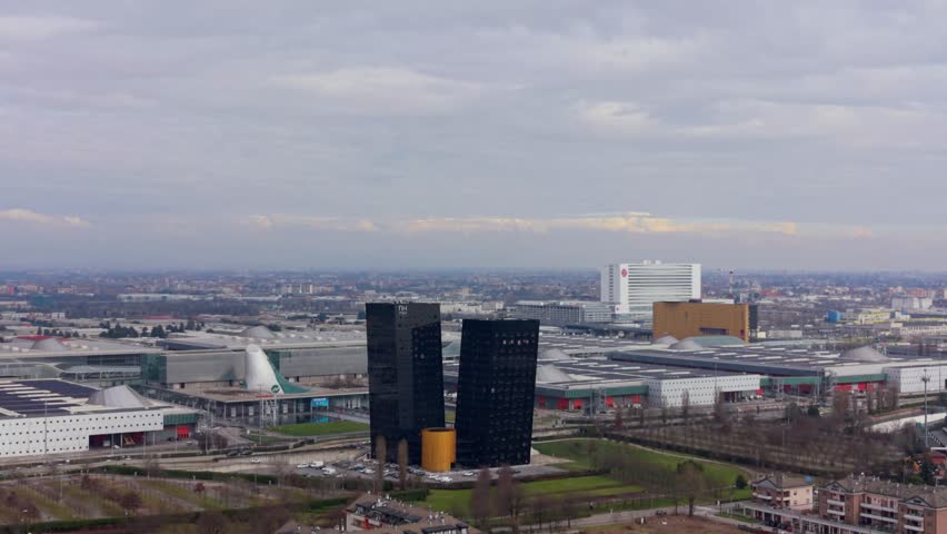 Aerial view of the fiera di bologna district with its characteristic twin towers on a cloudy day. Modern architecture and urban landscape
