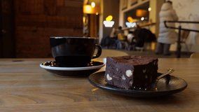 Intimate cafe scene featuring chocolate dessert and brewed coffee in soft ambient light - Powered by Shutterstock - Get 15% off with code: PIKWIZARD15